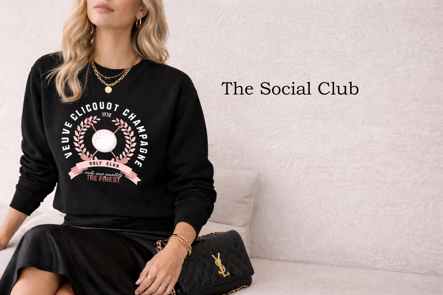 lady sitting wearing golf inspired sweatshirt